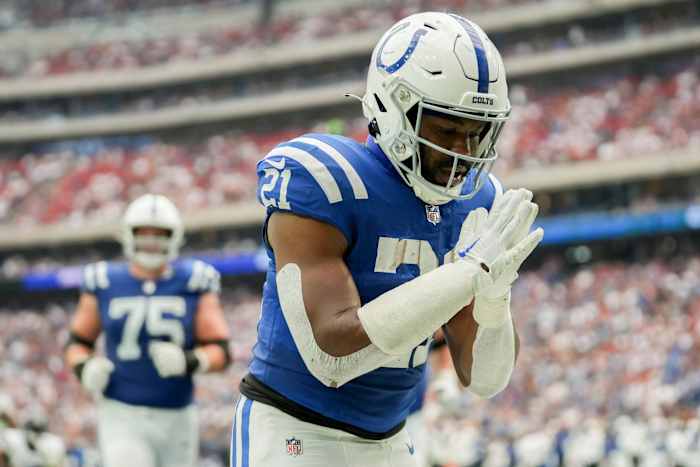Indianapolis Colts running back Zack Moss (21) bows in the end zone after running in a touchdown Sunday, Sept. 17, 2023, during a game against the Houston Texans at NRG Stadium in Houston